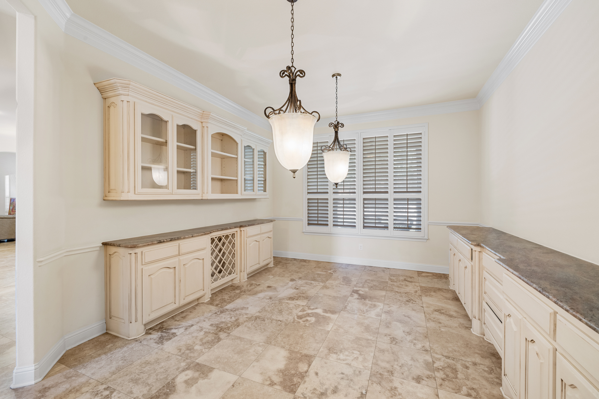 Elegant dining room with built-in cabinetry in DFW luxury estate