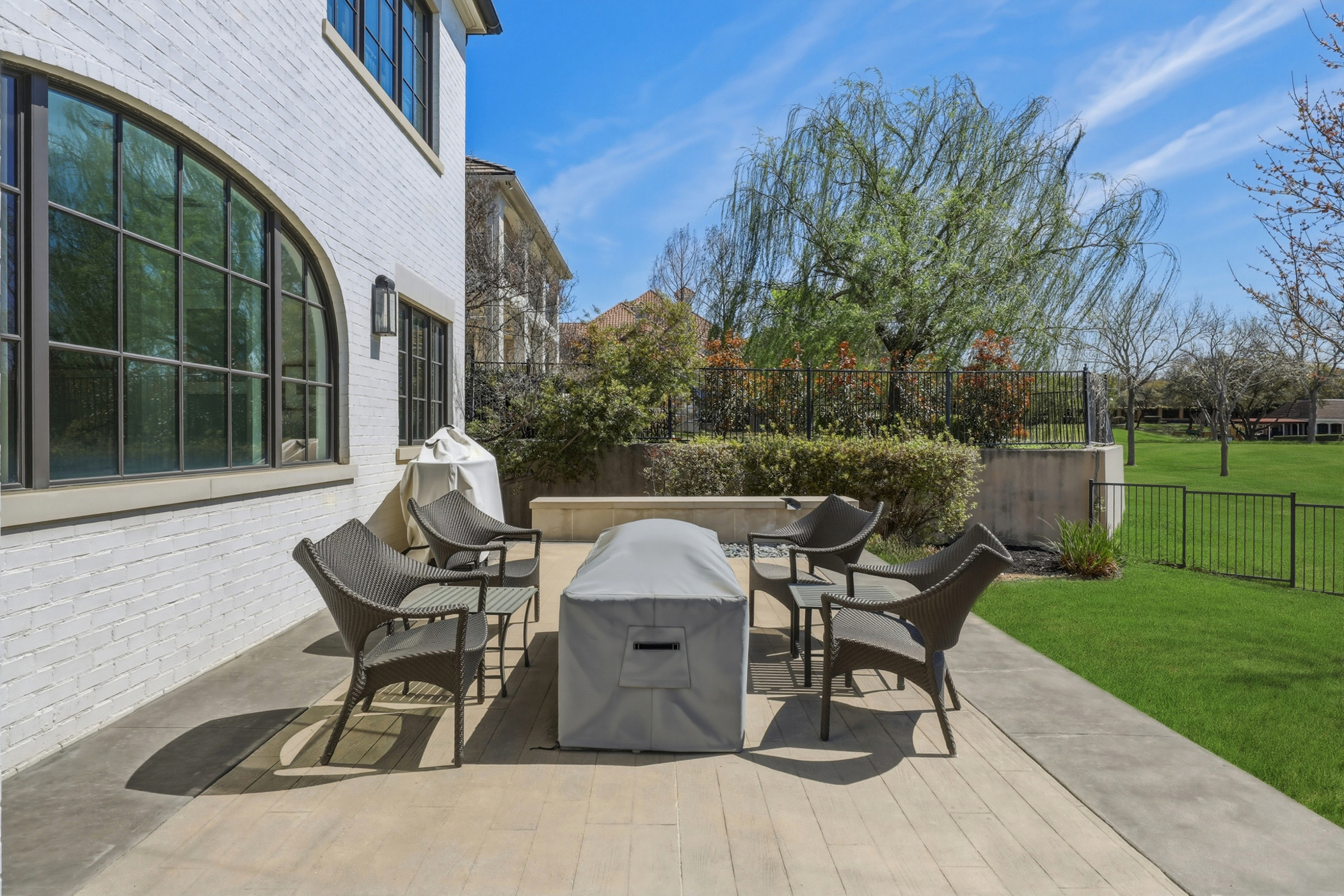 Outdoor living space with patio seating at Colleyville luxury home